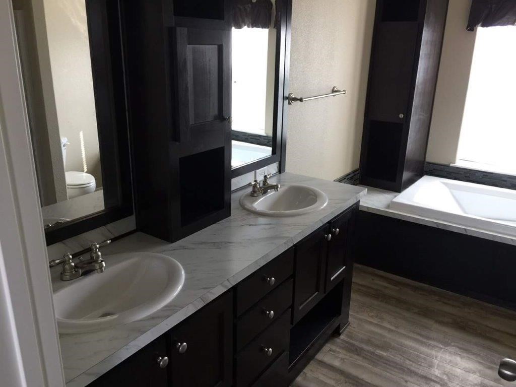 The ING682F MAPLE        (FULL) GW Master Bathroom. This Manufactured Mobile Home features 4 bedrooms and 2 baths.