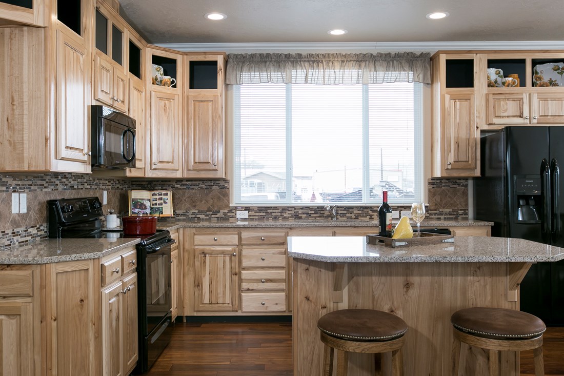 The THE SPRUCE Kitchen. This Manufactured Mobile Home features 3 bedrooms and 2 baths.