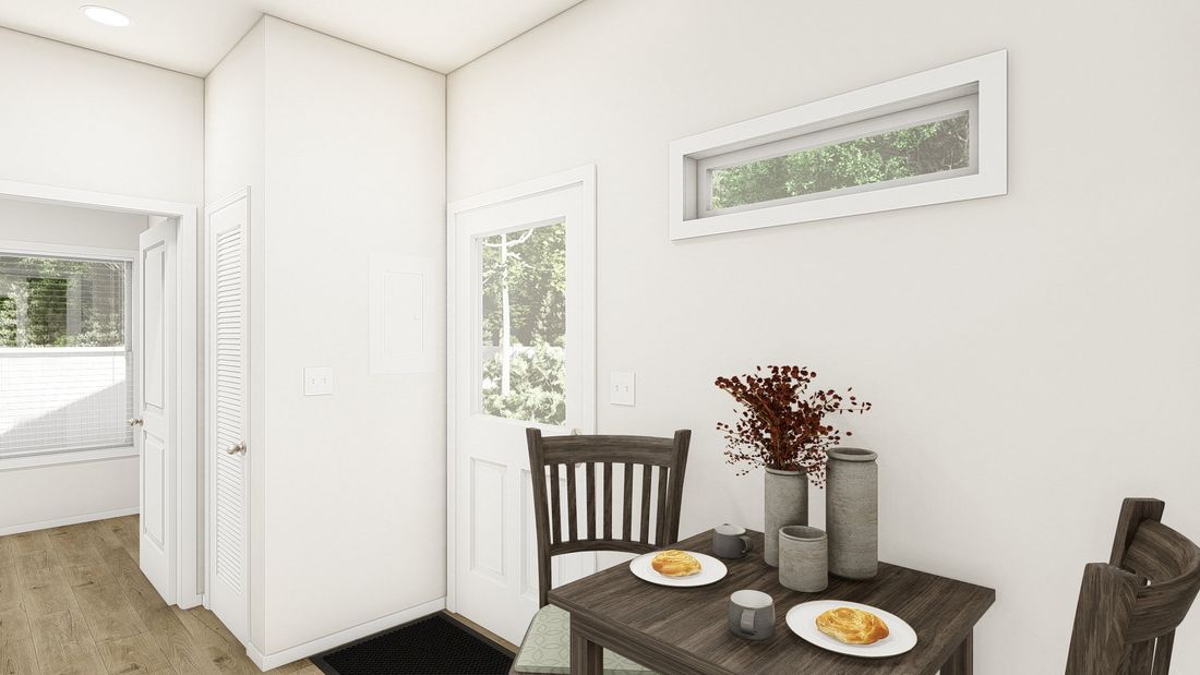 The CASITA 30-1M+8'PORCH DREAM Dining Area. This Manufactured Mobile Home features 1 bedroom and 1 bath.