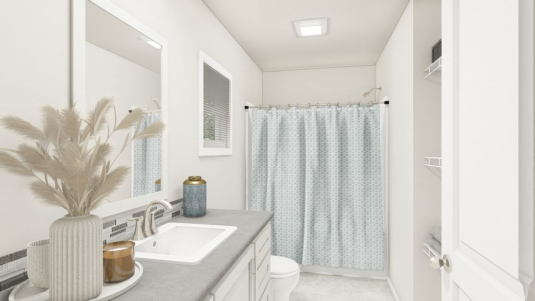 The DRM385A 2438' DREAM Primary Bathroom. This Manufactured Mobile Home features 3 bedrooms and 2 baths.