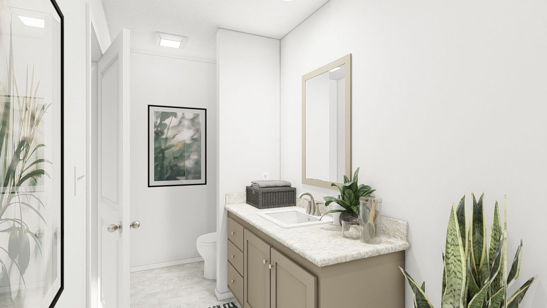 The DRM603N 1560' DREAM Primary Bathroom. This Manufactured Mobile Home features 2 bedrooms and 2 baths.